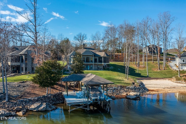 view of dock featuring a water view and a yard