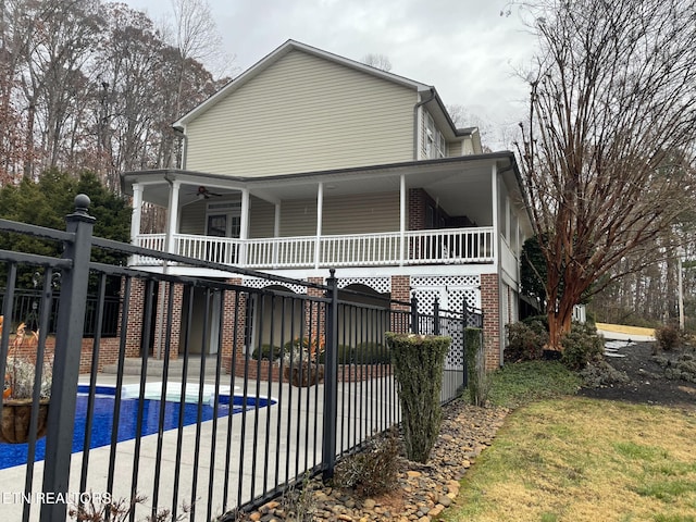 back of property with ceiling fan