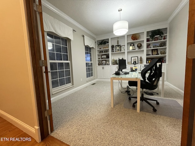 home office with a textured ceiling, built in features, and crown molding