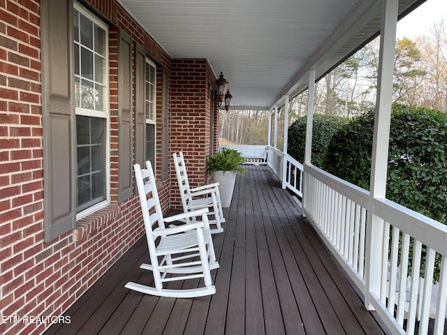 wooden terrace with a porch