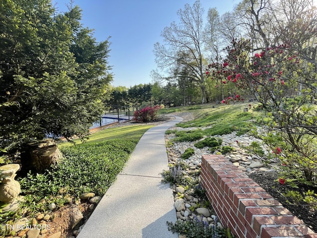 view of property's community with fence
