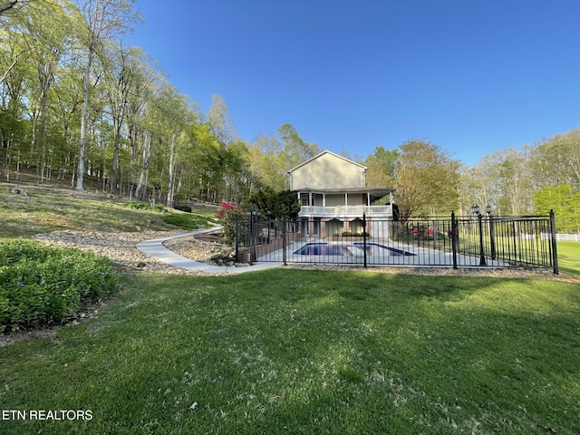 view of swimming pool with a fenced in pool, fence, a patio, and a yard