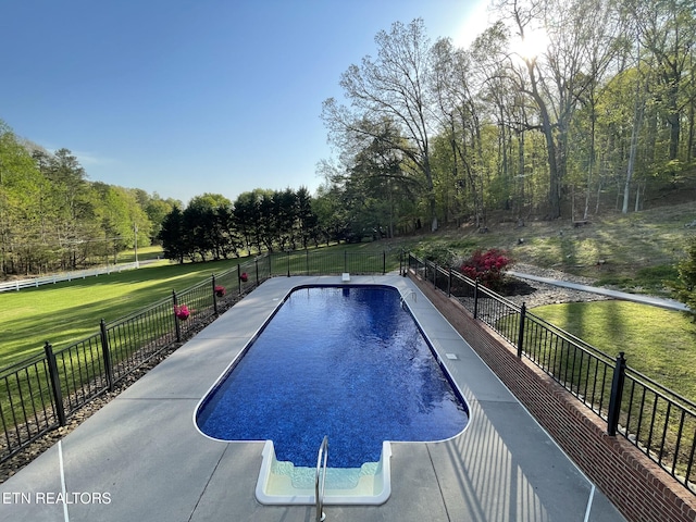 view of pool with a lawn, a fenced in pool, and fence