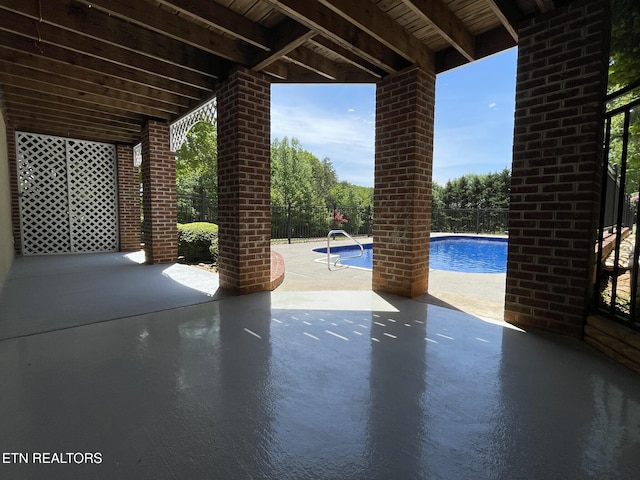 view of patio / terrace featuring fence and a fenced in pool