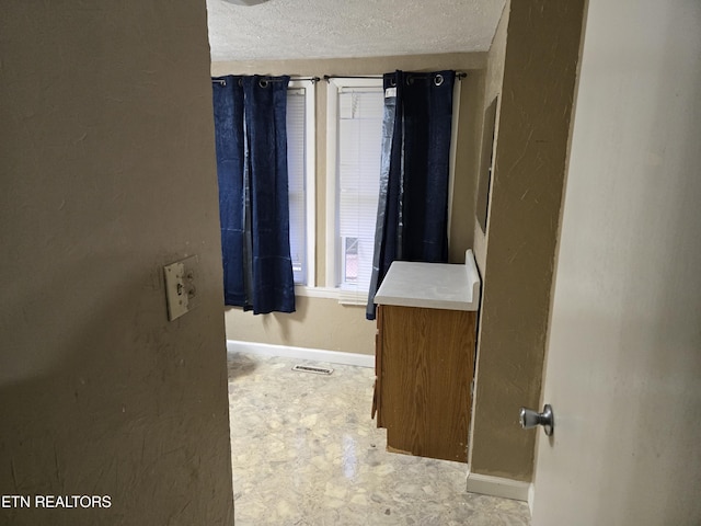 bathroom with a textured ceiling