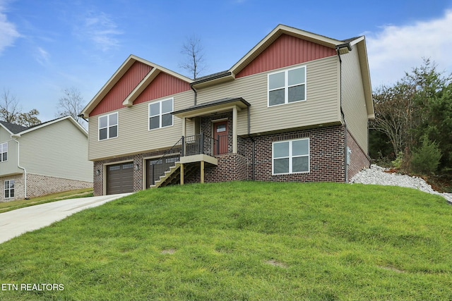 view of front of property with a garage and a front yard