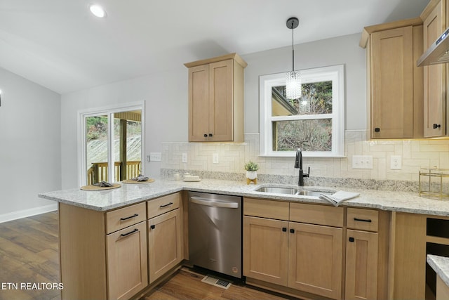 kitchen with hanging light fixtures, dishwasher, dark hardwood / wood-style floors, and sink