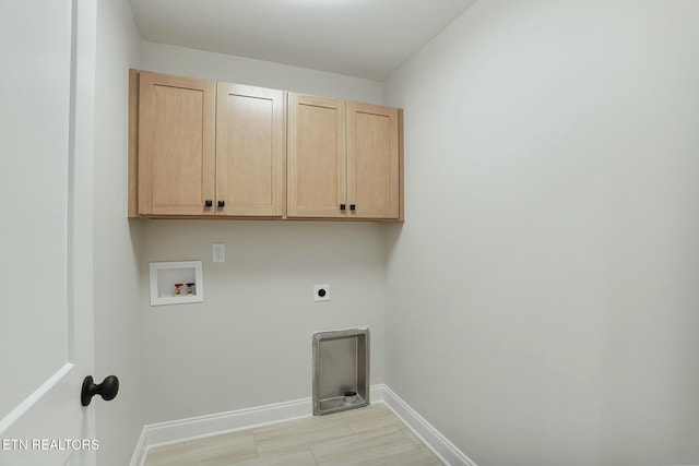 laundry room featuring cabinets, washer hookup, and hookup for an electric dryer