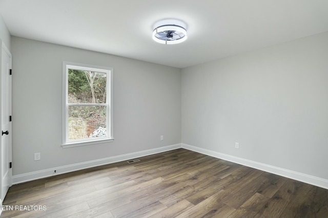 unfurnished room featuring hardwood / wood-style floors