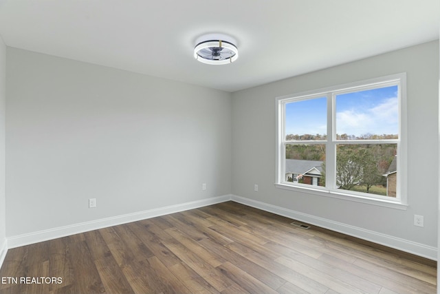 unfurnished room featuring wood-type flooring