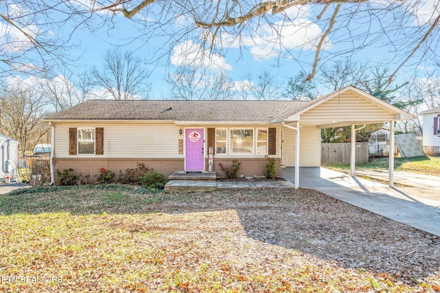 single story home with a carport and a front lawn