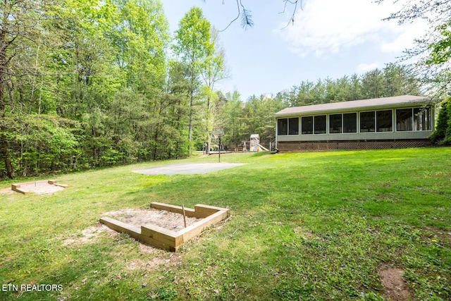 view of yard featuring a sunroom