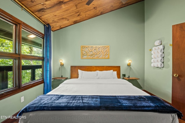 bedroom featuring multiple windows, wooden ceiling, and vaulted ceiling