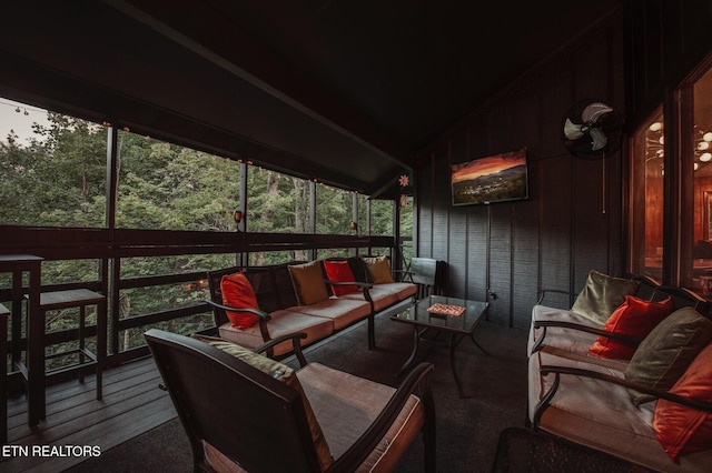 sunroom / solarium with lofted ceiling