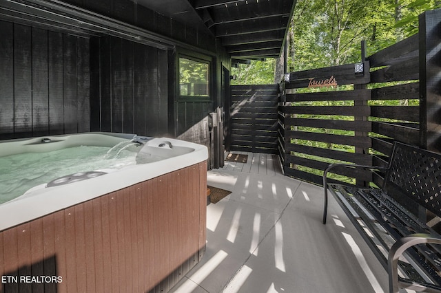 view of patio / terrace featuring a hot tub