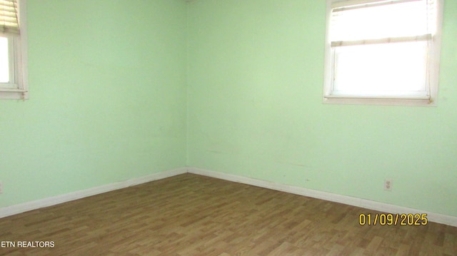 empty room featuring wood-type flooring