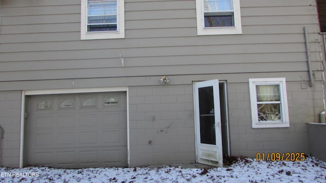 view of snow covered garage