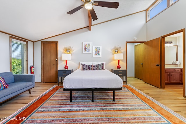 bedroom with ensuite bathroom, ornamental molding, vaulted ceiling, ceiling fan, and light hardwood / wood-style flooring