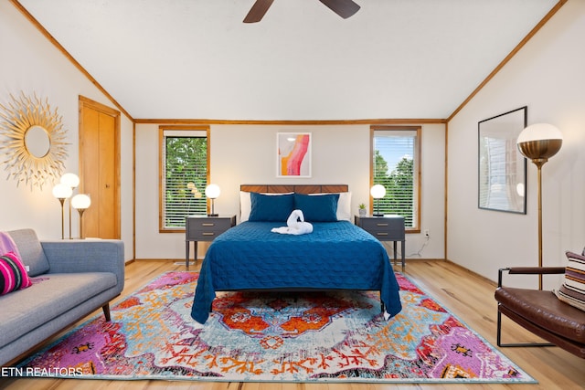 bedroom featuring ceiling fan, light hardwood / wood-style flooring, and vaulted ceiling