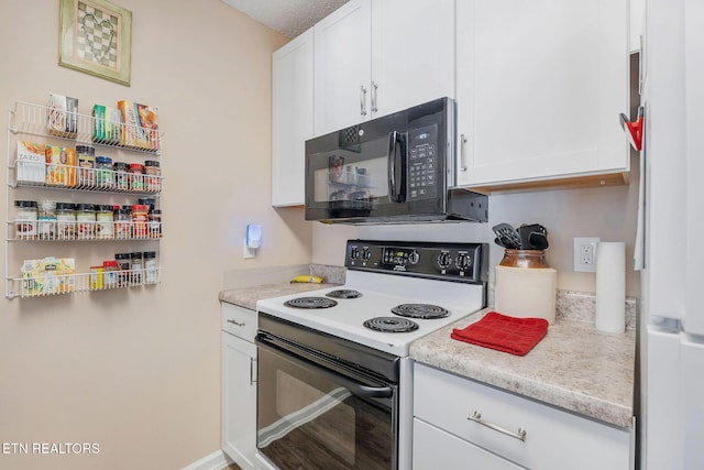 kitchen with white cabinetry, light stone counters, and white appliances