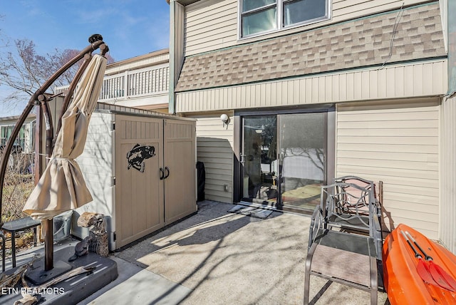 view of patio with a storage shed