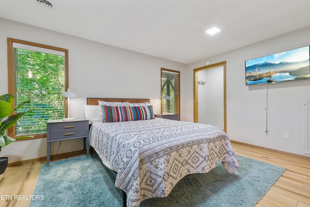 bedroom with light hardwood / wood-style floors