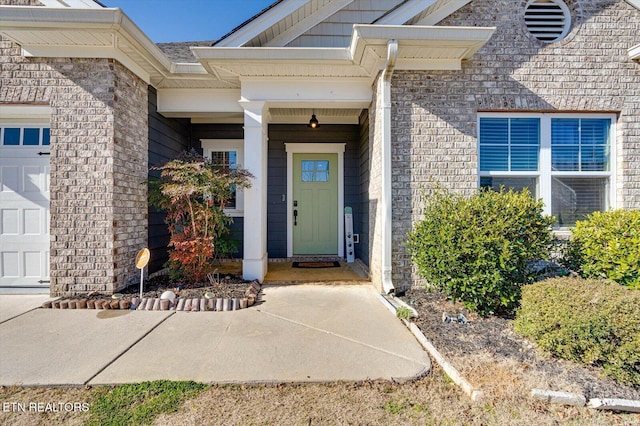 entrance to property featuring a garage