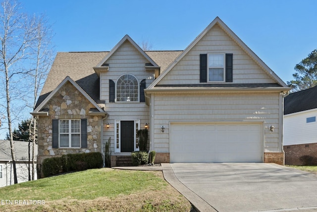 view of front of house featuring a front yard and a garage