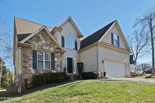 view of front of property with a garage and a front lawn