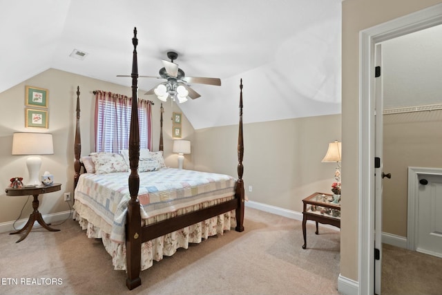 carpeted bedroom featuring ceiling fan and vaulted ceiling