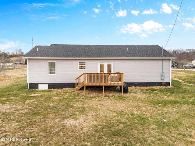 rear view of house with french doors, a yard, and a deck