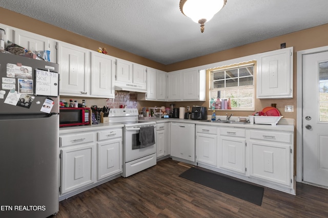 kitchen with sink, white appliances, white cabinets, and a textured ceiling