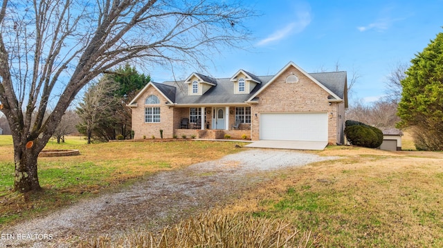 view of front of home with a front lawn, a porch, and a garage