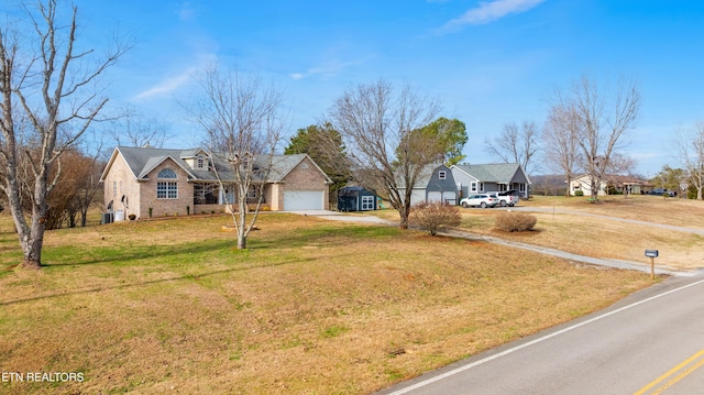 view of front of house with a front yard and a garage