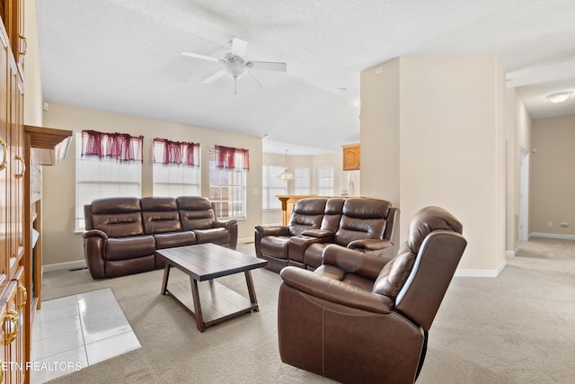 carpeted living room with a textured ceiling, ceiling fan with notable chandelier, and lofted ceiling