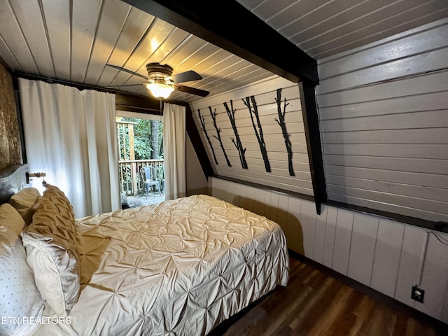 bedroom with ceiling fan, dark hardwood / wood-style flooring, wood ceiling, and wooden walls