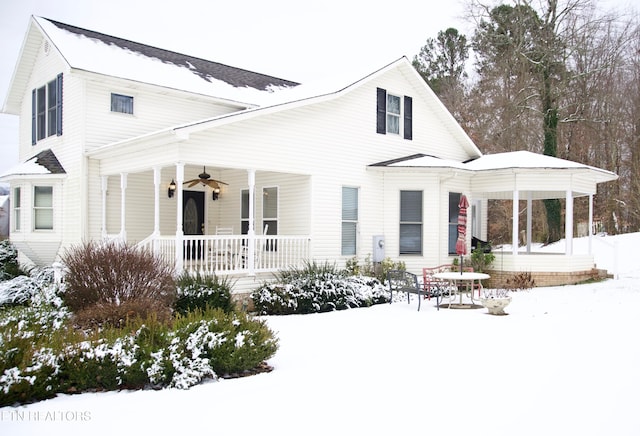 view of front facade featuring ceiling fan and covered porch