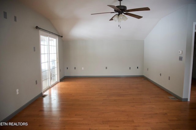 interior space featuring ceiling fan, lofted ceiling, and light wood-type flooring