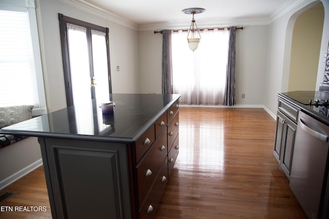 kitchen featuring a center island, plenty of natural light, and dishwasher