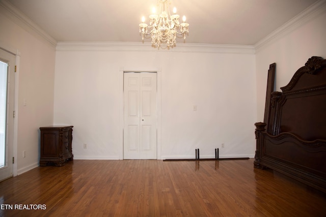 interior space with crown molding, dark hardwood / wood-style floors, and an inviting chandelier