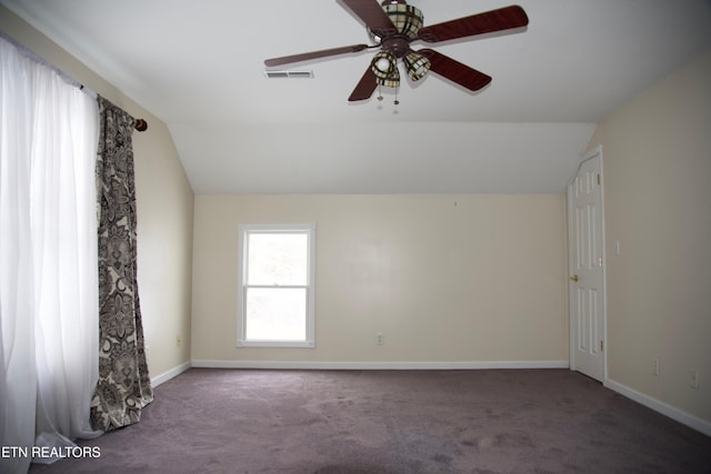 carpeted empty room featuring ceiling fan and lofted ceiling