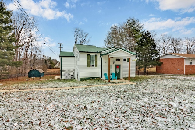 view of front of house with a shed