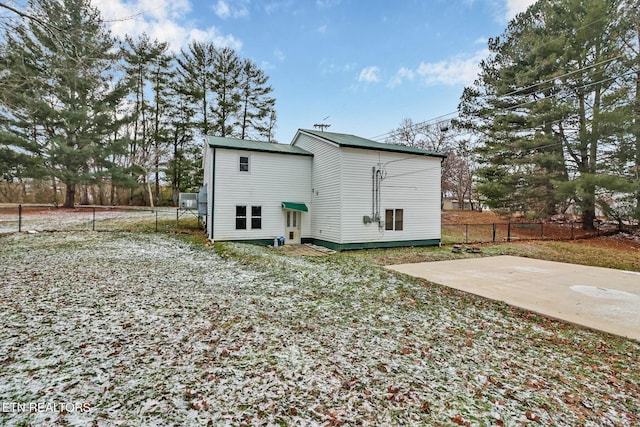 rear view of property featuring a patio