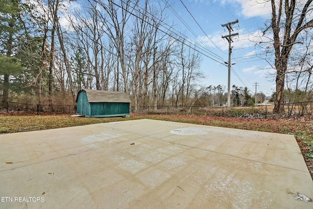 view of patio / terrace featuring a storage unit