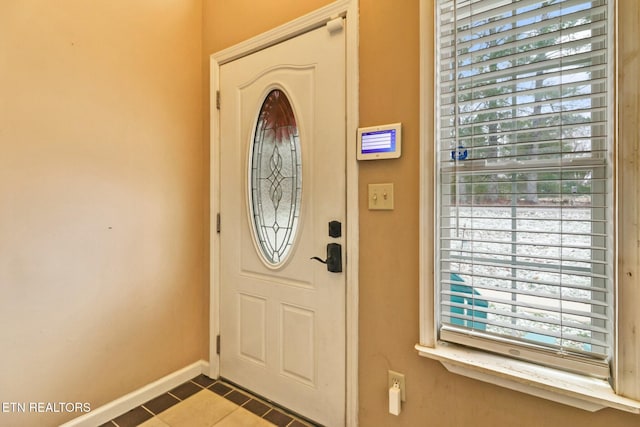 tiled entrance foyer with a wealth of natural light