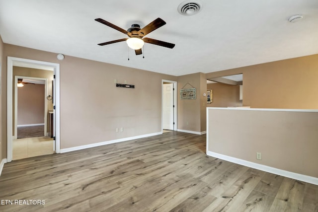 interior space featuring ceiling fan and light hardwood / wood-style flooring