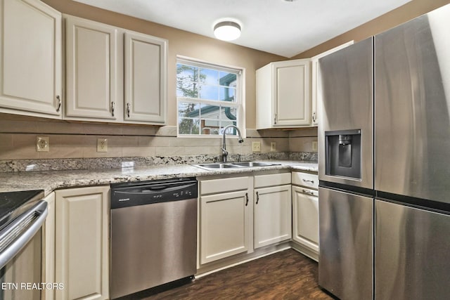 kitchen featuring sink, white cabinetry, dark hardwood / wood-style flooring, and stainless steel appliances