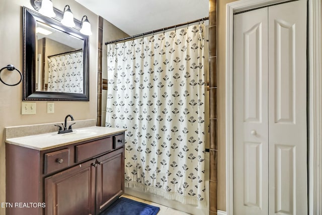 bathroom with vanity and curtained shower