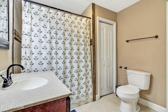 bathroom with toilet, vanity, a shower with curtain, and tile patterned flooring