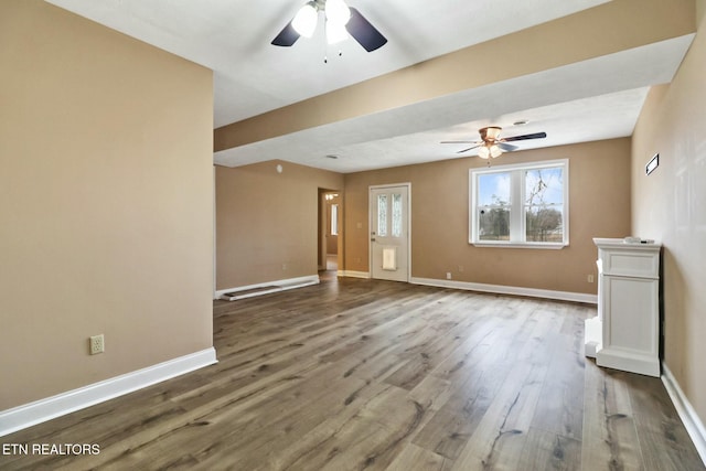 unfurnished living room featuring ceiling fan and hardwood / wood-style floors